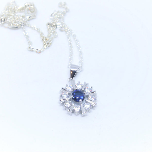 Sterling Silver Snowflake pendant w/- 1 Blue & White CZ's - SXP377